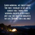 Good morning message love: A dawn scene with an illuminated tent under a starry sky, conveying a good morning love message.